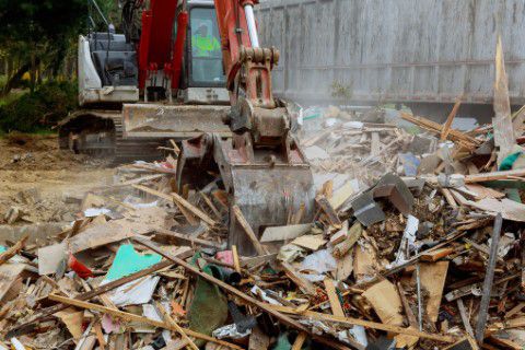 Excavator moving construction waste
