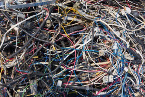 Old electronic wiring thrown out at a dump