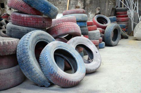 Old red and black tires in a transfer station